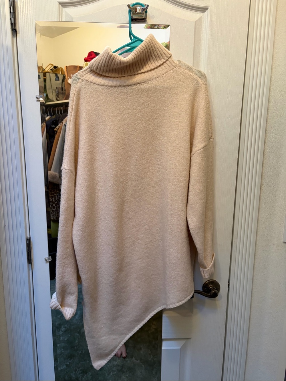Really soft turtleneck sweater. 38” on the long side and 28” on the shorter side